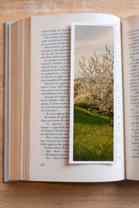 A New Life fine art bookmark resting in an open book, close-up