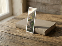 Ancient Tree fine art bookmark resting on a linen-bound book in soft window light