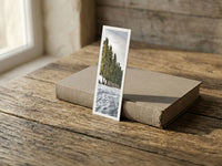 Arctic Glow fine art bookmark resting on a linen-bound book in soft window light