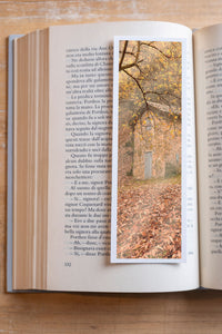 Autumn Cottage fine art bookmark resting in an open book, close-up