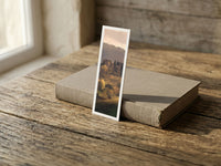 Autumn Hills fine art bookmark resting on a linen-bound book in soft window light