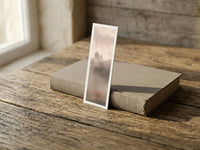 Autumn Solitude fine art bookmark resting on a linen-bound book in soft window light