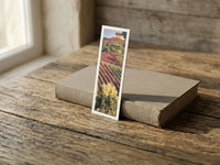 Autumn Vineyards fine art bookmark resting on a linen-bound book in soft window light