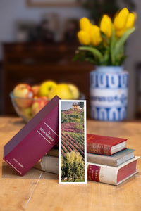 Autumn Vineyards fine art bookmark beside a stack of vintage books