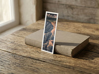 Bloomed Cherry fine art bookmark resting on a linen-bound book in soft window light