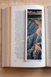 Bloomed Cherry fine art bookmark resting in an open book, close-up