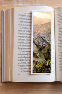 Chefchaouen fine art bookmark resting in an open book, close-up