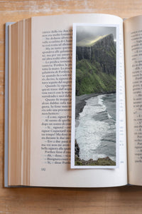 Cliff Waves fine art bookmark resting in an open book, close-up