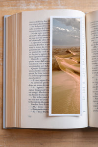 Copper Dunes fine art bookmark resting in an open book, close-up