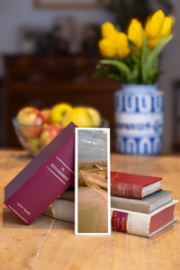 Copper Dunes fine art bookmark beside a stack of vintage books
