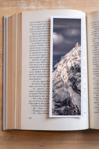 Crystal Peak fine art bookmark resting in an open book, close-up