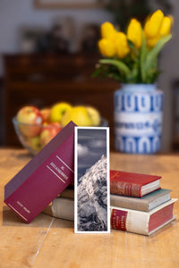 Crystal Peak fine art bookmark beside a stack of vintage books