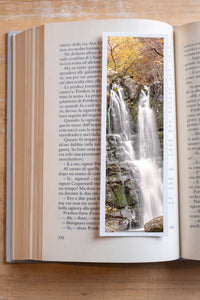Dardagna Waterfall fine art bookmark resting in an open book, close-up