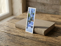 Deep Blue fine art bookmark resting on a linen-bound book in soft window light