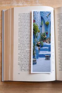 Deep Blue fine art bookmark resting in an open book, close-up