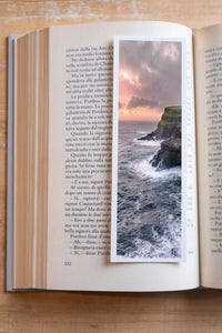 Edge of the World fine art bookmark resting in an open book, close-up