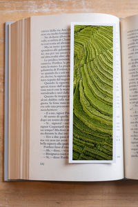 Emerald Terraces fine art bookmark resting in an open book, close-up
