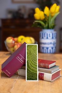Emerald Terraces fine art bookmark beside a stack of vintage books