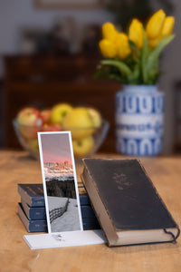Enrosadira fine art bookmark styled with a dark book and fresh fruit