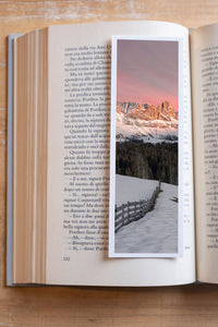 Enrosadira fine art bookmark resting in an open book, close-up