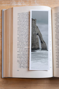 Etretat Arch fine art bookmark resting in an open book, close-up