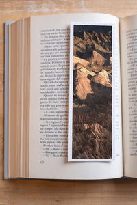Golden Ridges fine art bookmark resting in an open book, close-up