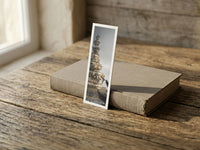 Golden Summit fine art bookmark resting on a linen-bound book in soft window light