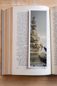 Golden Summit fine art bookmark resting in an open book, close-up