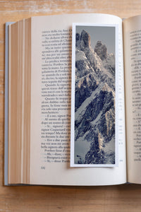 Icy Summit fine art bookmark resting in an open book, close-up