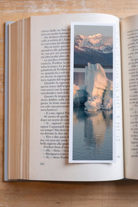 Icy Sunrise fine art bookmark resting in an open book, close-up