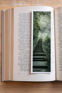 Jungle Stairway fine art bookmark resting in an open book, close-up