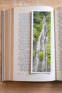 Jungle Tears fine art bookmark resting in an open book, close-up