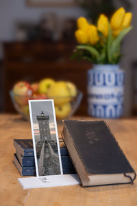Kermorvan fine art bookmark styled with a dark book and fresh fruit
