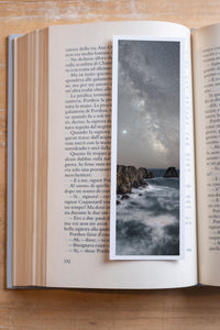Land's End fine art bookmark resting in an open book, close-up