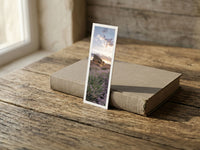 Lavender Farmer fine art bookmark resting on a linen-bound book in soft window light