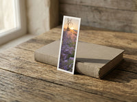 Lavender Sunrise fine art bookmark resting on a linen-bound book in soft window light