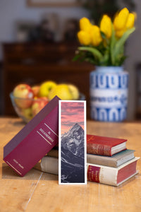 Lonely Mountain fine art bookmark beside a stack of vintage books