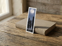 Midnight Veil fine art bookmark resting on a linen-bound book in soft window light