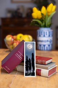 Midnight Veil fine art bookmark beside a stack of vintage books