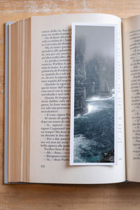 Misty Cliffs fine art bookmark resting in an open book, close-up