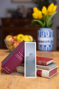 Misty Pagoda fine art bookmark beside a stack of vintage books