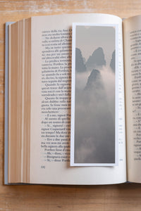 Misty Spires fine art bookmark resting in an open book, close-up