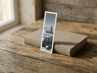 Point du Raz fine art bookmark resting on a linen-bound book in soft window light