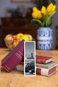 Point du Raz fine art bookmark beside a stack of vintage books
