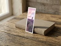Purple Breeze fine art bookmark resting on a linen-bound book in soft window light