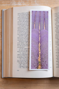 Purple Fields fine art bookmark resting in an open book, close-up