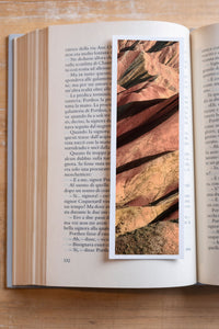 Rainbow Ridge fine art bookmark resting in an open book, close-up
