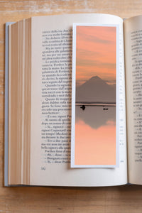 Reflection Twins fine art bookmark resting in an open book, close-up