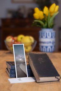 Sahara Milky Way fine art bookmark styled with a dark book and fresh fruit