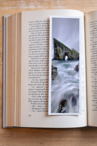 Sea Gate fine art bookmark resting in an open book, close-up